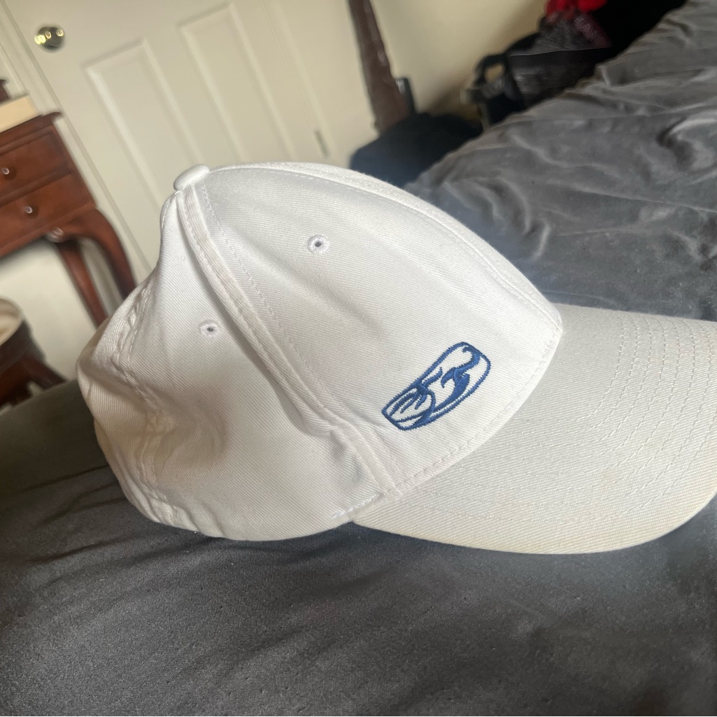White Baseball Cap With Blue Logo